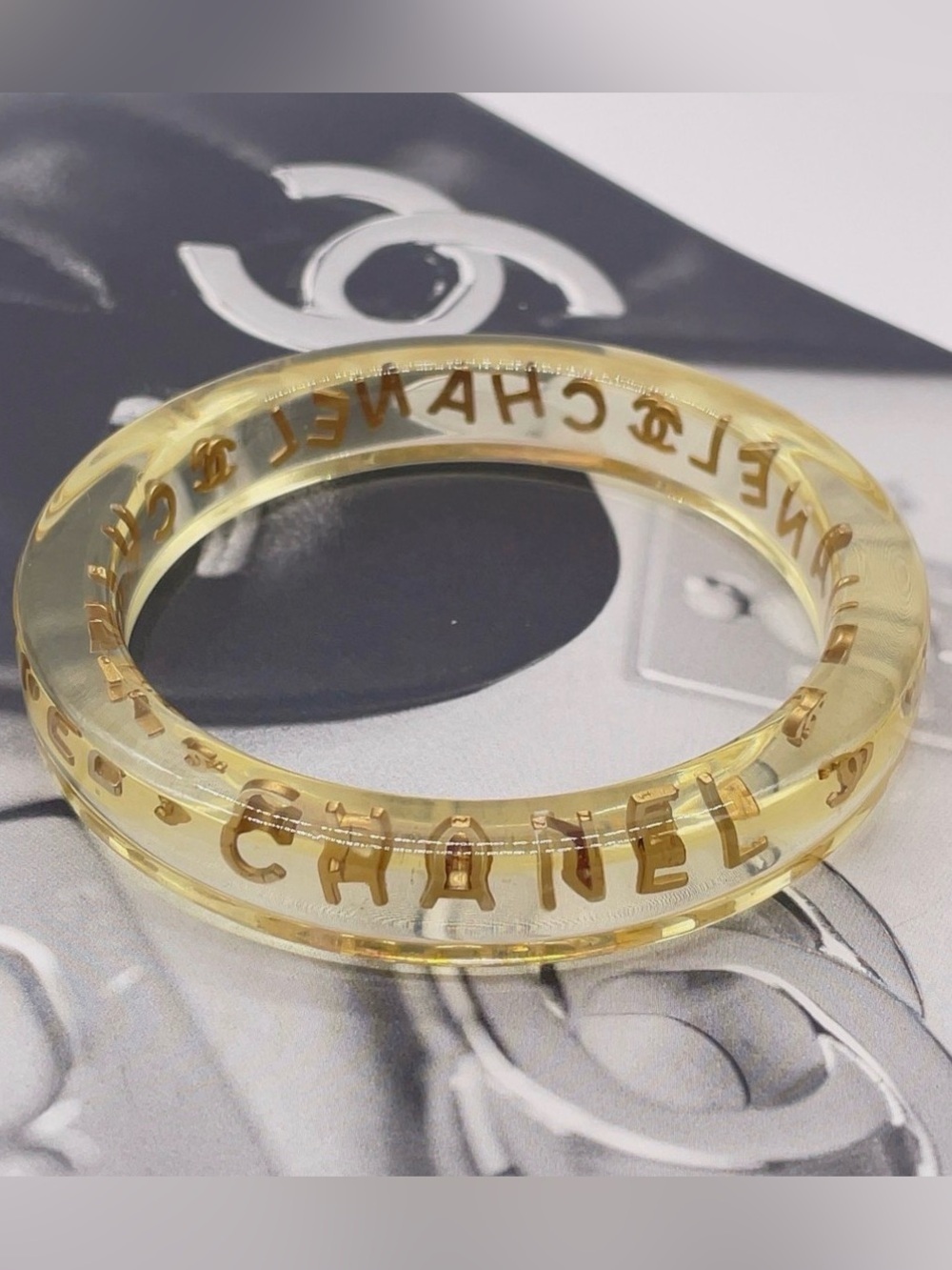 CHANEL LUCITE & Gold Letter Clear Acrylic Bangle - Picture 5 of 12